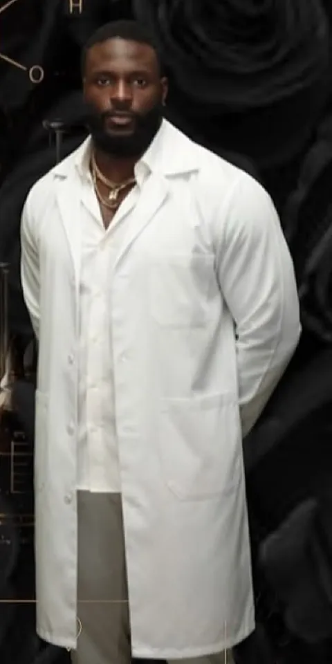 Key, founder of Key Fragrance, in a white lab coat